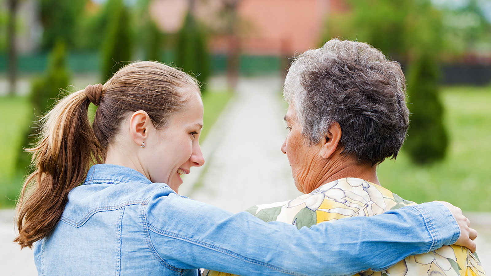 Young lady showing compassion to elderly woman