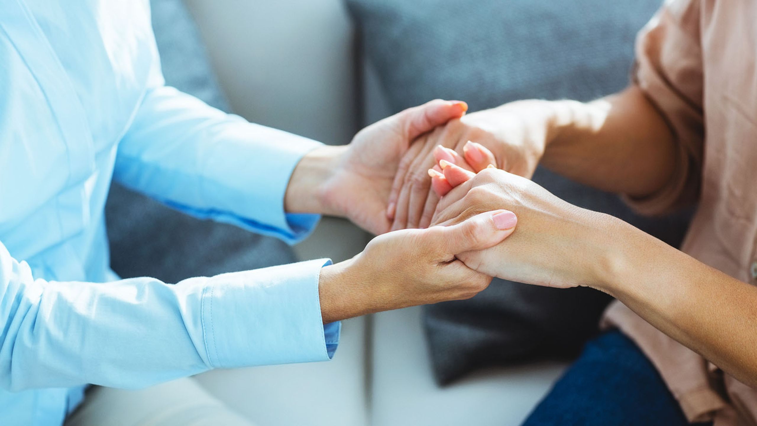 Two people holding hands