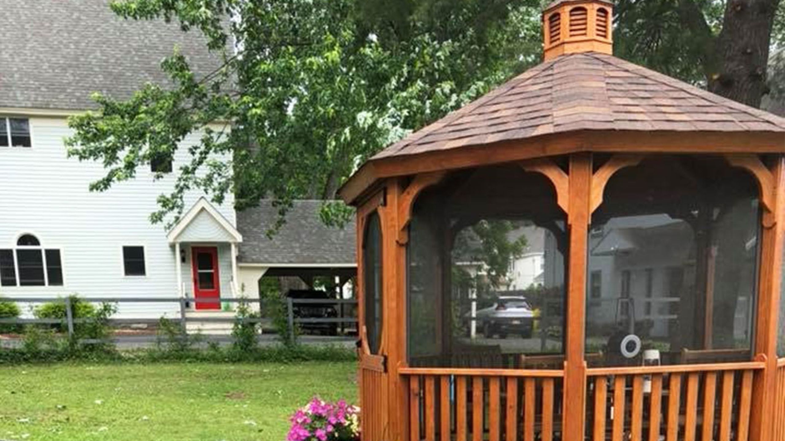 Photo of a gazebo and houses in the distance