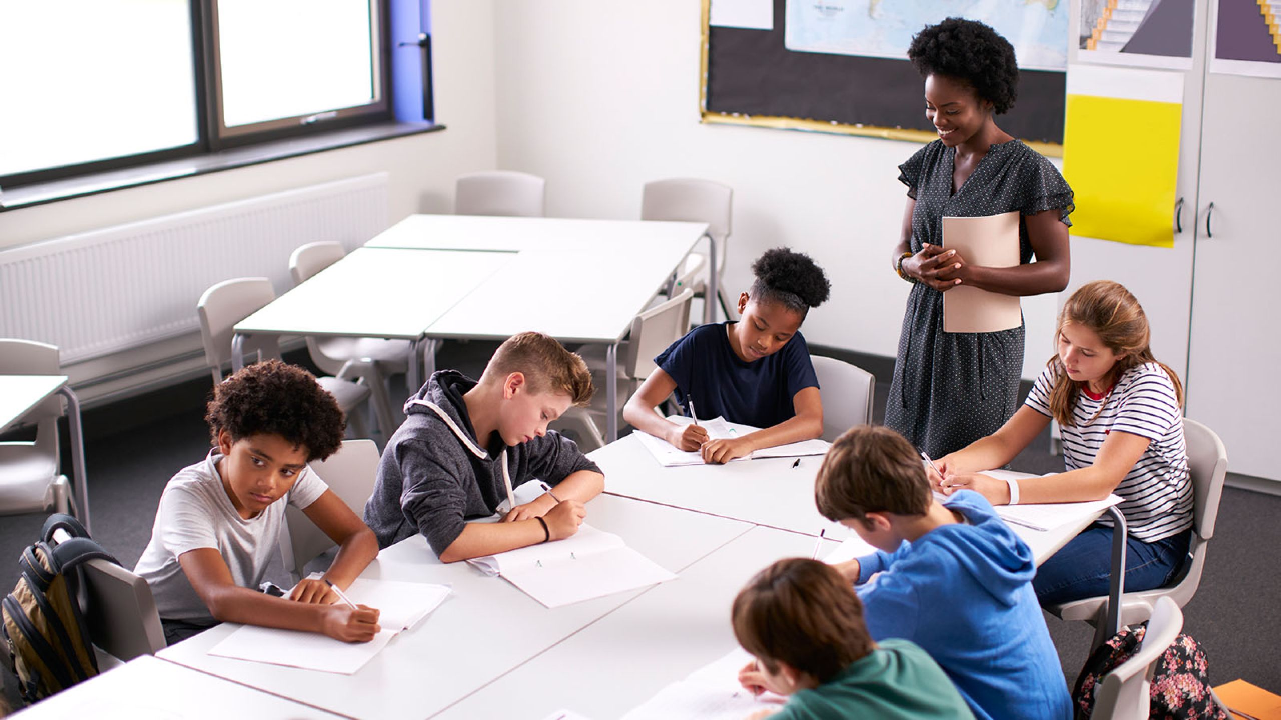 Children doing school work at a table